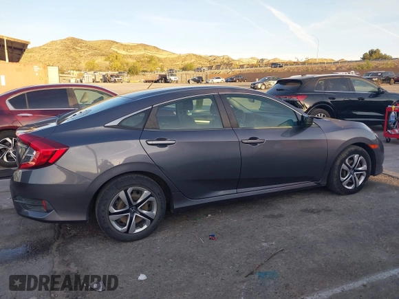 2016 Honda Civic Sedan LX with VIN 2HGFC2F55GH532108, listed as a IAAI auction lot 41860382 with 124,106 mi miles. Bid and sale history available at carsss.com. Image 13.