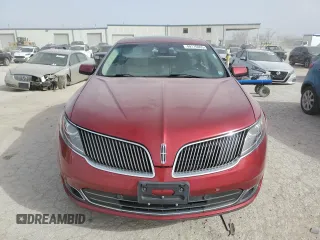 2013 Lincoln MKS z VIN 1LNHL9DK6DG613520, wystawiony jako Copart lot #49176965 z przebiegiem 89 594 mil mil oraz Szkoda całkowita • Salvage title. Historia ofert i sprzedaży dostępna na DreamBid. Obrazek 5.