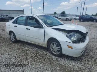 2003 Ford Focus SE with VIN 1FAFP34353W231334, listed as a Copart auction lot 63844205 with 86,601 mi miles and Salvage title. Bid and sale history available at DreamBid. Image 4.