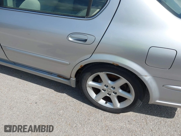 2003 Nissan Maxima SE with VIN JN1DA31D33T513282, listed as a IAAI auction lot 42289710 with 343,973 mi miles and . Bid and sale history available at DreamBid. Image 14.