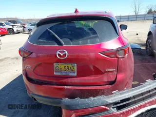2020 Mazda CX-5 Grand Touring with VIN JM3KFADM3L0761286, listed as a IAAI auction lot 41715379 with 145,656 mi miles and . Bid and sale history available at DreamBid. Image 17.