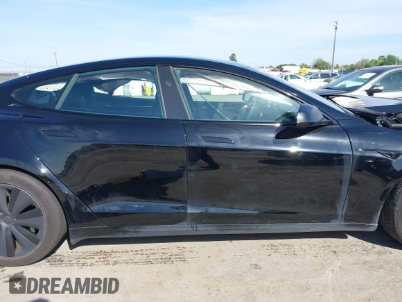 2023 Tesla Model S with VIN 5YJSA1E54PF531021, listed as a IAAI auction lot 42014104 with Not provided miles and . Bid and sale history available at DreamBid. Image 13.