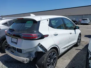 2023 Chevrolet Bolt EV 2LT z VIN 1G1FX6S07P4198027, wystawiony jako IAAI lot #42453916 z przebiegiem 5 133 mil mil oraz . Historia ofert i sprzedaży dostępna na DreamBid. Obrazek 4.