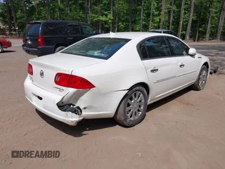2009 Buick Lucerne CXL with VIN 1G4HD57M79U135698, listed as a IAAI auction lot 42165966 with 131,615 mi miles. Bid and sale history available at carsss.com. Image 4.