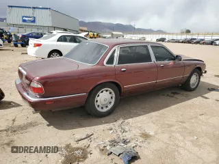 1998 Jaguar XJ Vanden Plas with VIN SAJKX6245WC830912, listed as a Copart auction lot 49717285 with 127,509 mi miles and Salvage Title. Bid and sale history available at DreamBid. Image 3.