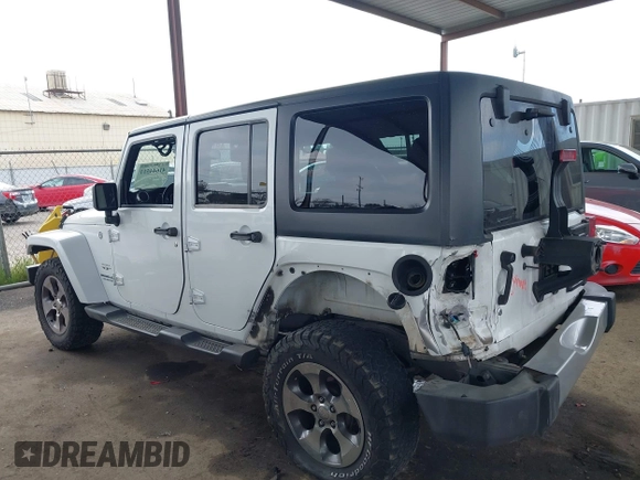 2017 Jeep Wrangler Unlimited Sahara with VIN 1C4HJWEG0HL595144, listed as a IAAI auction lot 41644511 with 143,512 mi miles. Bid and sale history available at carsss.com. Image 15.