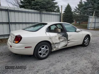 2001 Oldsmobile Aurora z VIN 1G3GS64CX14180971, wystawiony jako Copart lot #79035554 z przebiegiem 62 228 mil mil oraz Szkody całkowita. Historia ofert i sprzedaży dostępna na DreamBid. Obrazek 3.
