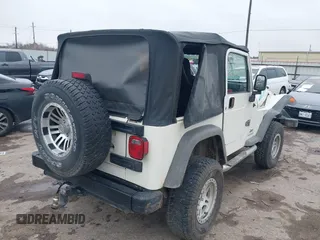 2005 Jeep Wrangler Sport with VIN 1J4FA49S25P320240, listed as a IAAI auction lot 41433371 with 144,552 mi miles. Bid and sale history available at carsss.com. Image 4.