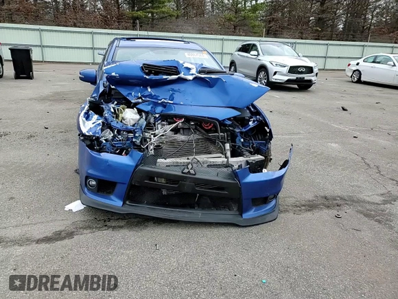 2015 Mitsubishi Lancer Evolution GSR z VIN JA32W8FV7FU023106, wystawiony jako Copart lot #40867084 z przebiegiem 103 964 mil mil oraz Szkoda całkowita • Salvage title. Historia ofert i sprzedaży dostępna na DreamBid. Obrazek 11.