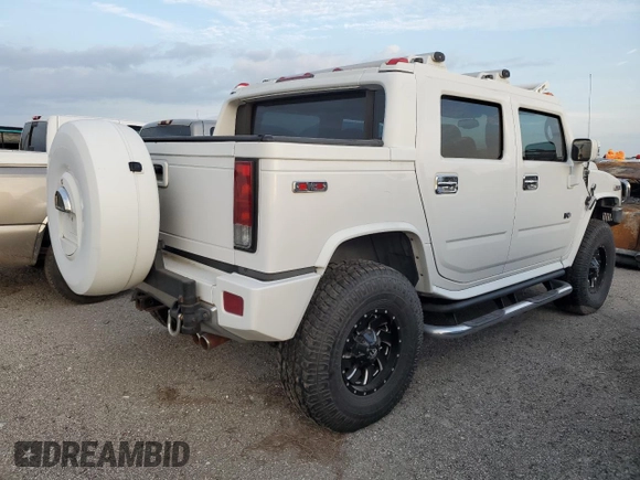2006 Hummer H2 with VIN 5GRGN22U56H105928, listed as a Copart auction lot 76692904 with 0 mi miles and Salvage Title. Bid and sale history available at carsss.com. Image 3.