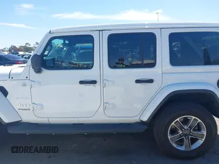 2019 Jeep Wrangler Unlimited Sahara with VIN 1C4HJXENXKW684942, listed as a IAAI auction lot 42021869 with 55,137 mi miles and . Bid and sale history available at DreamBid. Image 14.