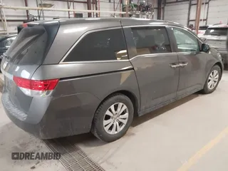 2015 Honda Odyssey EX-L with VIN 5FNRL5H64FB055890, listed as a IAAI auction lot 41706141 with 155,167 mi miles and . Bid and sale history available at carsss.com. Image 4.