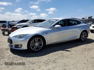2014 Tesla Model S 60 with VIN 5YJSA1H14EFP36439, listed as a Copart auction lot 65833035 with 66,090 mi miles and Clean title. Bid and sale history available at DreamBid. Image 1.