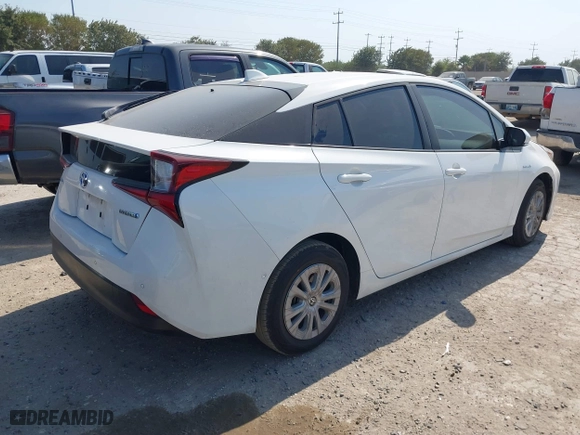2021 Toyota Prius L Eco with VIN JTDKAMFU6M3141263, listed as a IAAI auction lot 40593951 with 95,921 mi miles. Bid and sale history available at carsss.com. Image 4.