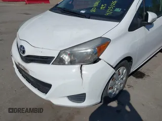 2014 Toyota Yaris L with VIN VNKJTUD35EA011933, listed as a IAAI auction lot 42150303 with 114,369 mi miles. Bid and sale history available at carsss.com. Image 12.