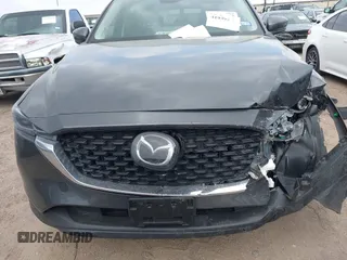 2023 Mazda CX-5 S Carbon Edition z VIN JM3KFBCM7P0226930, wystawiony jako IAAI lot #41939956 z przebiegiem 29 477 mil mil oraz . Historia ofert i sprzedaży dostępna na DreamBid. Obrazek 12.