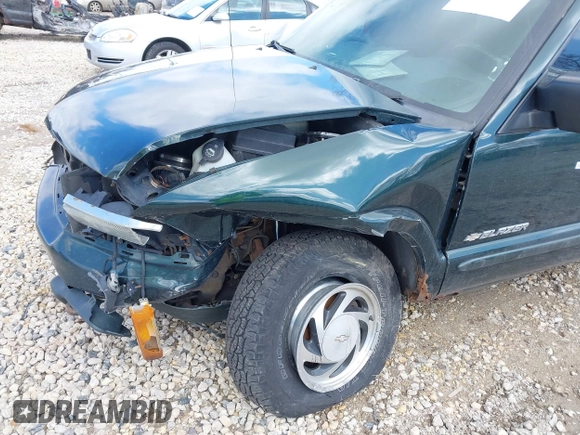 2003 Chevrolet Blazer LS z VIN 1GNDT13X93K177170, wystawiony jako IAAI lot #41839837 z przebiegiem 148 555 mil mil oraz . Historia ofert i sprzedaży dostępna na DreamBid. Obrazek 13.