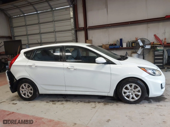 2013 Hyundai Accent GL with VIN KMHCT5AE6DU122559, listed as a IAAI auction lot 41800714 with 129,582 mi miles. Bid and sale history available at carsss.com. Image 13.