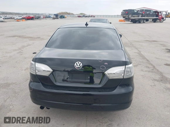 2014 Volkswagen Jetta SE z VIN 3VWD17AJ7EM388375, wystawiony jako IAAI lot #42144779 z przebiegiem 104 801 mil mil oraz . Historia ofert i sprzedaży dostępna na DreamBid. Obrazek 12.