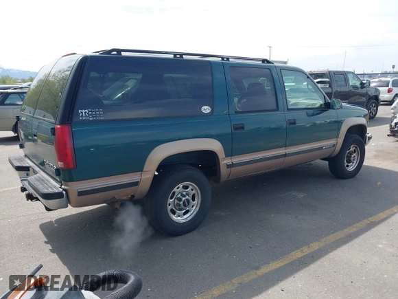 1995 Chevrolet Suburban with VIN 1GNGK26N9SJ397588, listed as a IAAI auction lot 42114009 with 238,914 mi miles. Bid and sale history available at carsss.com. Image 4.