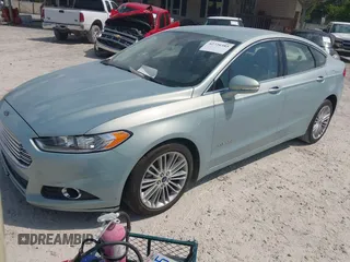 2013 Ford Fusion SE Hybrid z VIN 3FA6P0LU8DR265460, wystawiony jako IAAI lot #42720385 z przebiegiem 146 179 mil mil oraz . Historia ofert i sprzedaży dostępna na DreamBid. Obrazek 2.