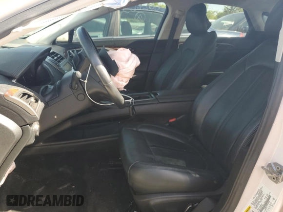 2015 Lincoln MKZ with VIN 3LN6L2J99FR602863, listed as a Copart auction lot 56679335 with 33,859 mi miles and Salvage title. Bid and sale history available at DreamBid. Image 7.