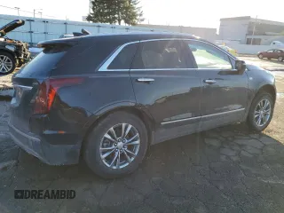 2021 Cadillac XT5 AWD Premium Luxury with VIN 1GYKNDRS6MZ111640, listed as a Copart auction lot 46567035 with 57,484 mi miles and Salvage Title. Bid and sale history available at DreamBid. Image 3.