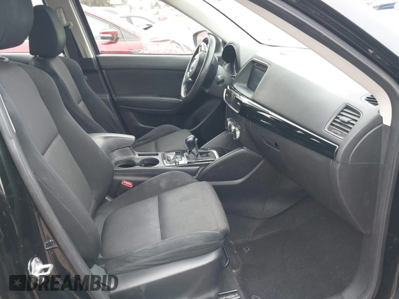 2016 Mazda CX-5 Sport with VIN JM3KE2BY4G0761933, listed as a IAAI auction lot 41709274 with 131,127 mi miles. Bid and sale history available at carsss.com. Image 5.
