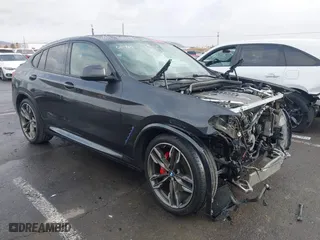 2021 BMW X4 M40i with VIN 5UX2V5C0XM9E16773, listed as a IAAI auction lot 41230634 with 52,779 mi miles. Bid and sale history available at carsss.com. Image 1.