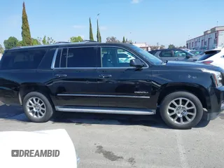 2015 GMC Yukon XL Denali with VIN 1GKS1JKJ1FR134428, listed as a IAAI auction lot 42149588 with 116,207 mi miles. Bid and sale history available at carsss.com. Image 13.