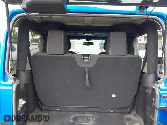 2015 Jeep Wrangler Sahara with VIN 1C4AJWBG9FL663959, listed as a IAAI auction lot 42133900 with 56,253 mi miles and . Bid and sale history available at DreamBid. Image 18.