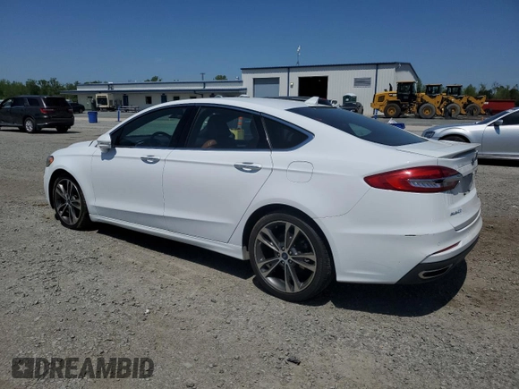 2020 Ford Fusion Titanium с VIN 3FA6P0K99LR174094, выставлен на аукционе Copart как лот 52583435 с пробегом 98 389 миль миль и Списание • Salvage title. История ставок и продаж доступна на DreamBid. Изображение 2.