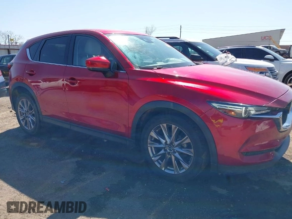 2019 Mazda CX-5 Grand Touring with VIN JM3KFADM5K1556917, listed as a IAAI auction lot 41706323 with 77,804 mi miles. Bid and sale history available at carsss.com. Image 1.
