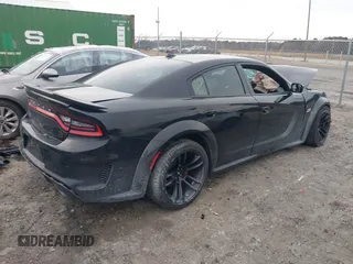 2022 Dodge Charger Scat Pack Widebody with VIN 2C3CDXGJXNH101398, listed as a IAAI auction lot 41408112 with 72,625 mi miles and . Bid and sale history available at DreamBid. Image 4.