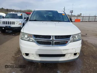 2014 Dodge Journey American Value with VIN 3C4PDCAB1ET209973, listed as a IAAI auction lot 41803864 with 168,774 mi miles and . Bid and sale history available at DreamBid. Image 12.