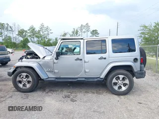 2016 Jeep Wrangler Unlimited Sahara with VIN 1C4BJWEG3GL240859, listed as a IAAI auction lot 42628937 with 103,378 mi miles and . Bid and sale history available at DreamBid. Image 14.