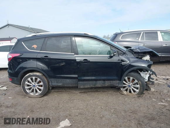 2018 Ford Escape Titanium with VIN 1FMCU0J90JUD17085, listed as a IAAI auction lot 41699687 with Not provided miles and . Bid and sale history available at DreamBid. Image 13.
