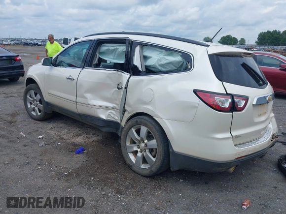 2014 Chevrolet Traverse LTZ with VIN 1GNKRJKD2EJ287211, listed as a IAAI auction lot 39873394 with 128,355 mi miles and . Bid and sale history available at DreamBid. Image 3.