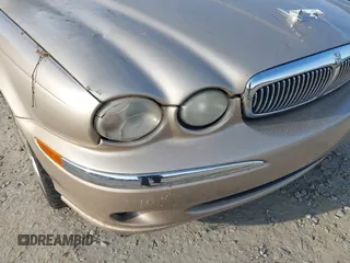 2004 Jaguar X-Type z VIN SAJEA51C84WD82052, wystawiony jako IAAI lot #42240141 z przebiegiem 50 631 mil mil oraz . Historia ofert i sprzedaży dostępna na DreamBid. Obrazek 13.