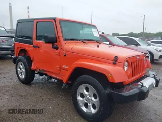 2015 Jeep Wrangler Altitude z VIN 1C4GJWBG7FL600675, wystawiony jako IAAI lot #42314122 z przebiegiem 84 577 mil mil oraz . Historia ofert i sprzedaży dostępna na DreamBid. Obrazek 1.