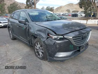 2018 Mazda CX-9 Sport with VIN JM3TCABY1J0224741, listed as a IAAI auction lot 41265876 with 126,686 mi miles and . Bid and sale history available at DreamBid. Image 1.