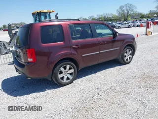 2012 Honda Pilot Touring with VIN 5FNYF4H90CB020623, listed as a IAAI auction lot 42048740 with 162,504 mi miles. Bid and sale history available at carsss.com. Image 4.