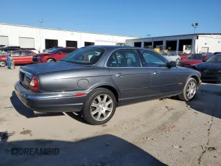 2004 Jaguar XJ VDP with VIN SAJWA74C54SG18384, listed as a Copart auction lot 83081974 with 141,664 mi miles and Salvage Title. Bid and sale history available at carsss.com. Image 3.