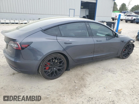 2021 Tesla Model 3 Performance with VIN 5YJ3E1EC5MF984986, listed as a Copart auction lot 52010205 with 48,012 mi miles and Salvage Title. Bid and sale history available at DreamBid. Image 3.