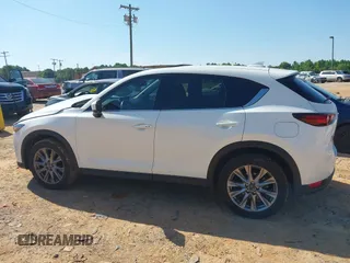 2021 Mazda CX-5 Grand Touring with VIN JM3KFBDM3M0493752, listed as a IAAI auction lot 42456854 with 35,122 mi miles and . Bid and sale history available at DreamBid. Image 14.