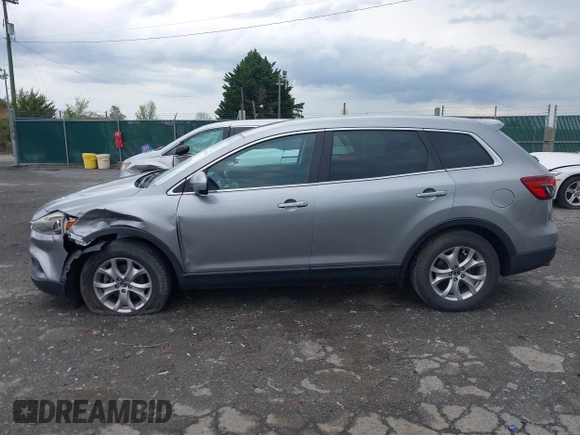 2015 Mazda CX-9 Sport with VIN JM3TB3BV2F0454770, listed as a IAAI auction lot 42009879 with 98,916 mi miles and . Bid and sale history available at carsss.com. Image 14.