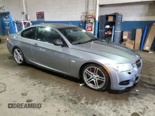 2011 BMW 3 Series 335is with VIN WBAKG1C56BE599457, listed as a Copart auction lot 52412655 with 134,497 mi miles and Clean title. Bid and sale history available at DreamBid. Image 4.