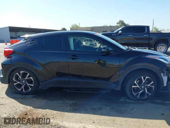 2020 Toyota C-HR LE with VIN JTNKHMBX9L1063563, listed as a IAAI auction lot 41986457 with 143,694 mi miles. Bid and sale history available at carsss.com. Image 14.