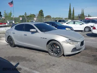 2014 Maserati Ghibli S Q4 with VIN ZAM57RTA8E1095303, listed as a IAAI auction lot 41600587 with 98,215 mi miles. Bid and sale history available at carsss.com. Image 13.