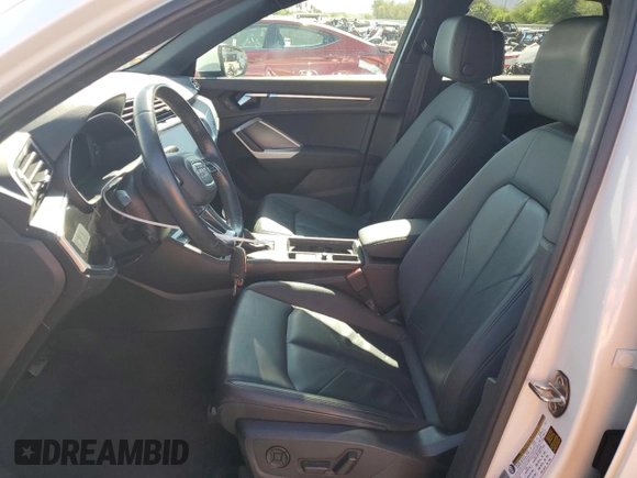2020 Audi Q3 Premium with VIN WA1AECF30L1023652, listed as a Copart auction lot 57148915 with 69,621 mi miles and Salvage title. Bid and sale history available at DreamBid. Image 7.